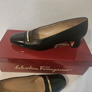 Salvatore Ferragamo Black patent leather toe gold accent logo